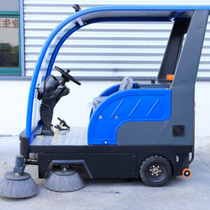 Fully enclosed electric ride on road sweeper